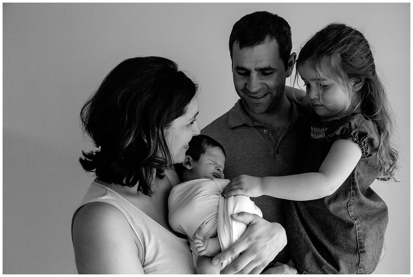 black and white newborn session family photo