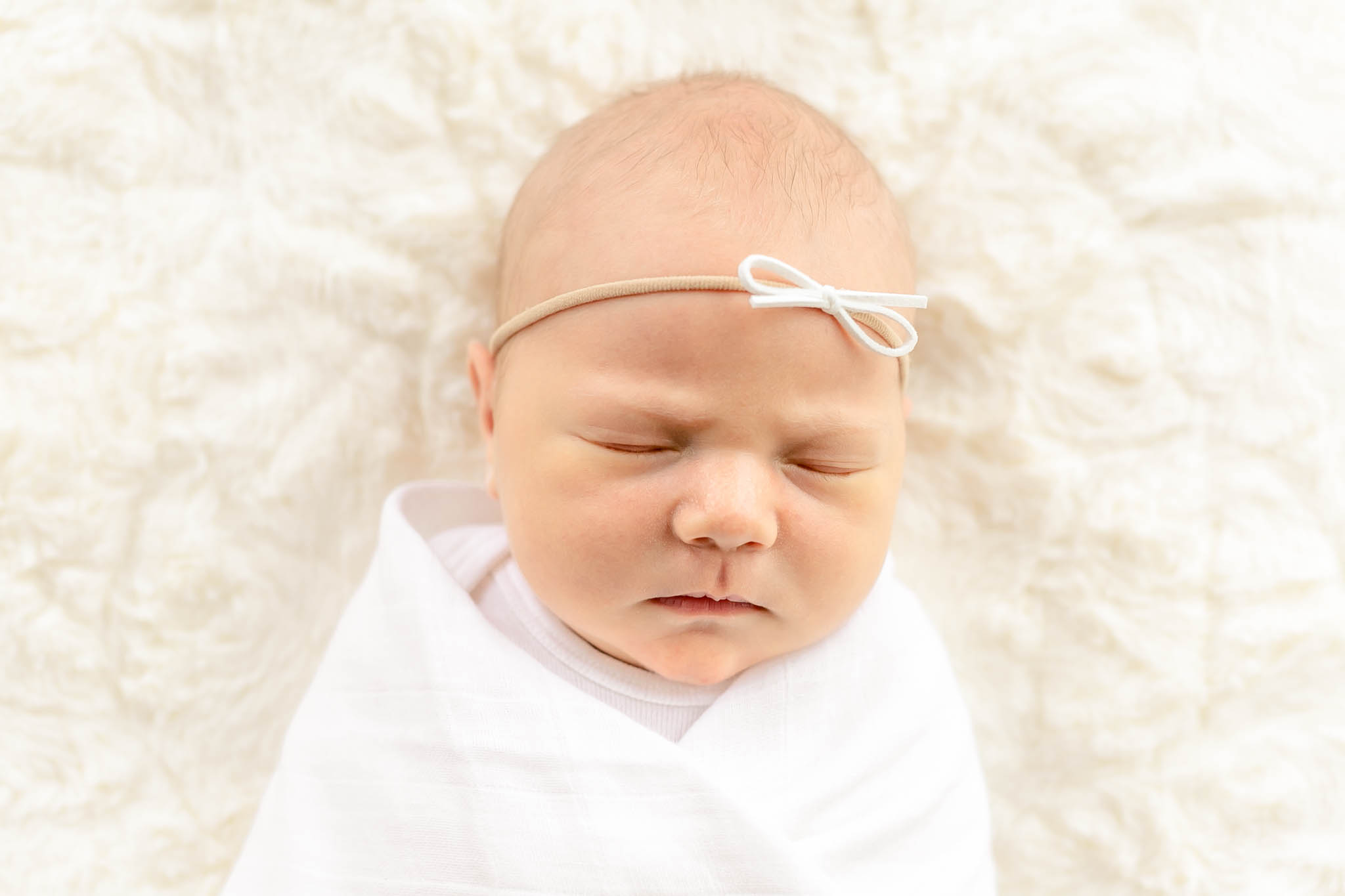 Newborn Baby wrapped in white swaddle Portland newborn photography