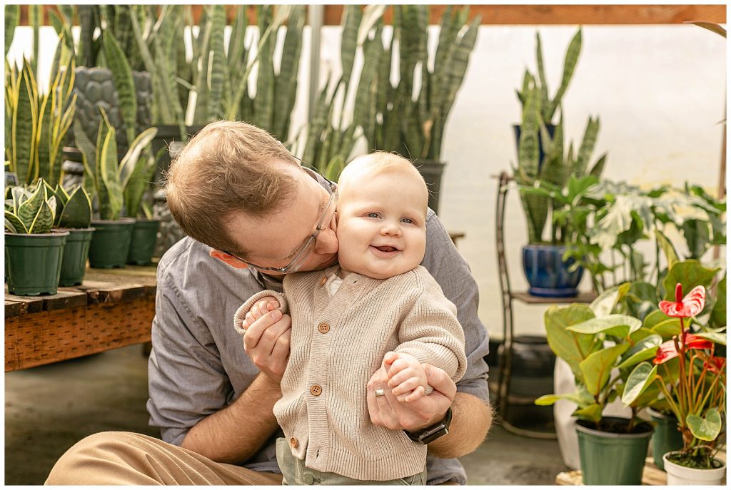 Nine month old baby portraits with dad at local greenhouse
