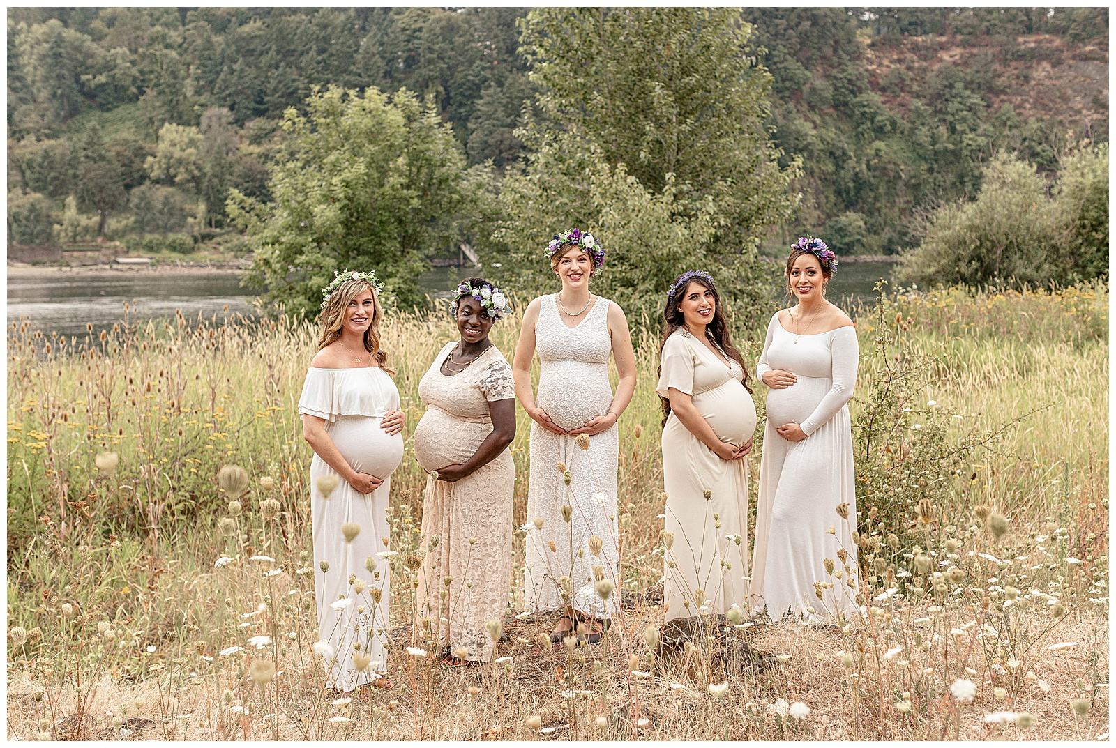 Five Pregnant Mamas in Pink Blush Dresses standing in a field of flowers during their maternity photography session in portland oregon