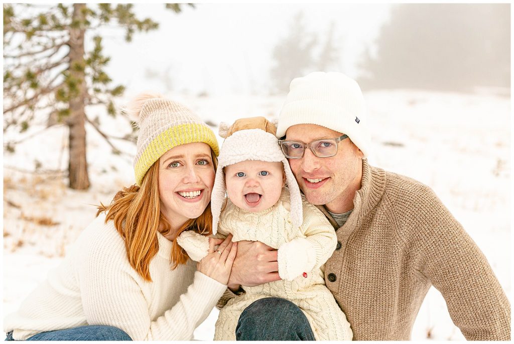 Mom Dad and Baby portraits in the snow in winter