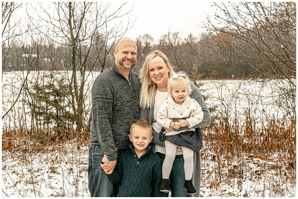 Winter family portraits with snow on the ground