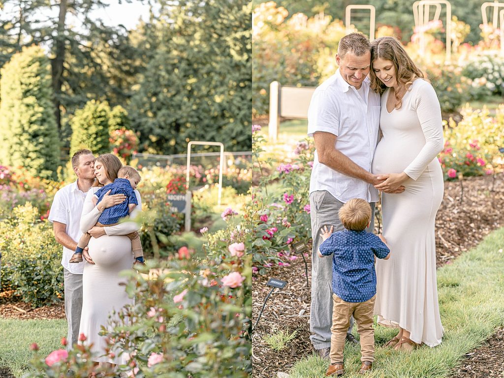 Man in white shirt and grey pants, Pregnant woman in long white dress and toddler boy in blue shirt and khaki pants at the Portland Rose Gardens