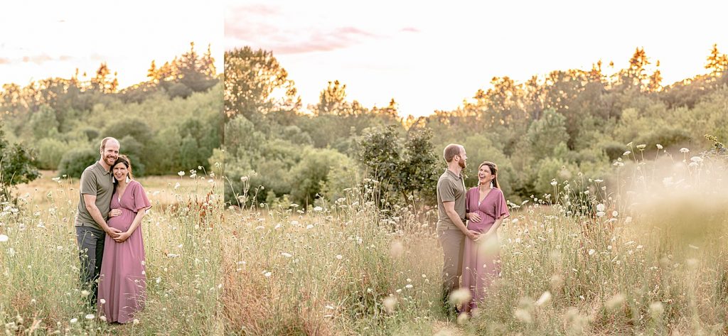 Man in green shirt and dark pants and pregnant woman in mauve dress out in a wildflower field posing for portraits