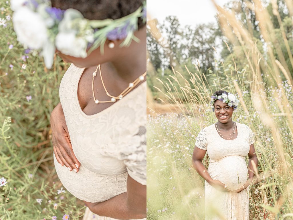 black pregnant woman holding belly out in nature wearing a cream dress