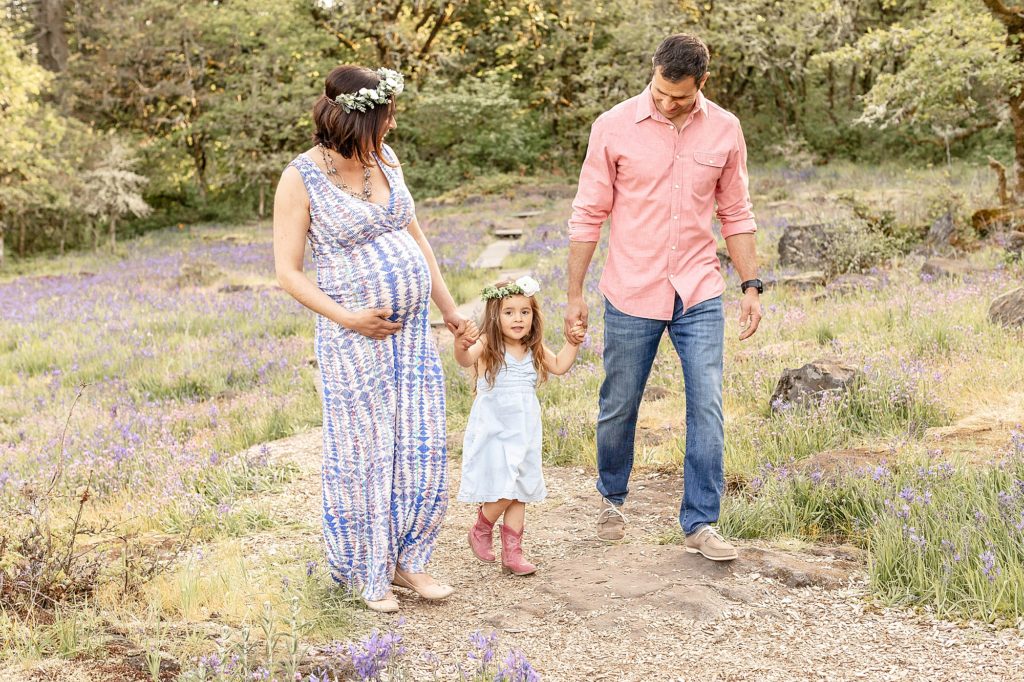 Pregnant Mom, 2 year old girl, and dad dressed up at Camassia Nature Park for maternity photos
