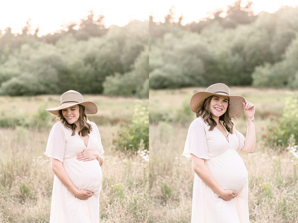 light-skinned pregnant woman wearing a cream dress out in nature wearing a boho hat for maternity portraits