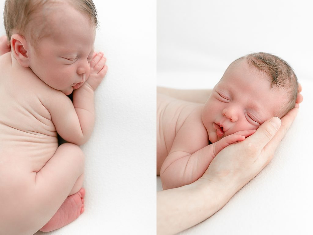 baby sleeping on white backdrop at newborn portrait session