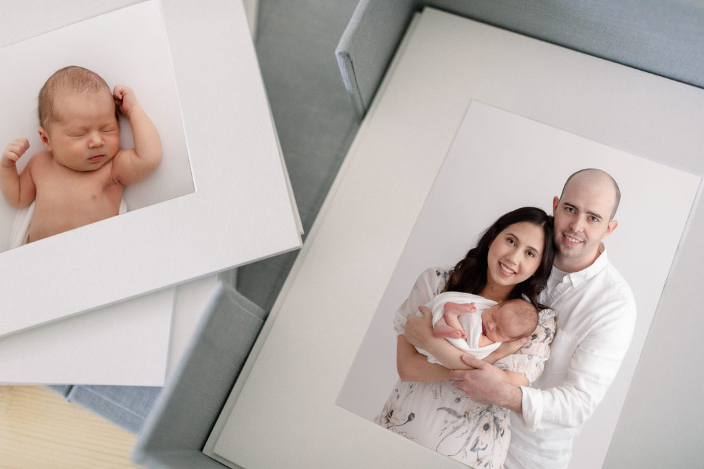 Professional Newborn Photos matted and stored in a beautiful linen box.