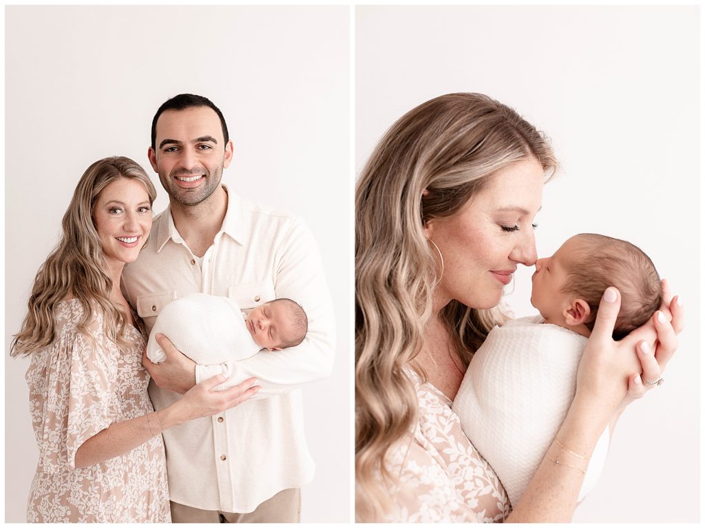 Proud Mom and Dad holding sleeping newborn baby swaddled in white at minimal + timeless newborn photography session.