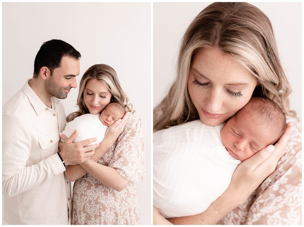 Parents dressed in neutral colors - beige & white, holding newborn baby wrapped in white and portland newborn photography session.