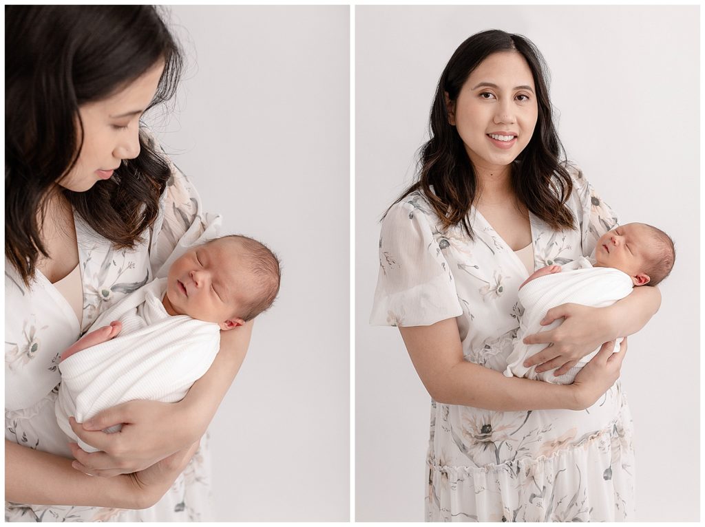 New Mom dressed in a beautiful white dress with small light colored flowers on it. Mom is holding newborn baby wrapped in a white swaddle. Photo on the left Mom is looking down at baby and photo on the right mom is looking at the camera. 