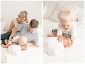 Family of four with newborn baby. Everyone is looking at baby. Family dressed in light, neutral tones and colors. Photos include an older 2 year old sibling.