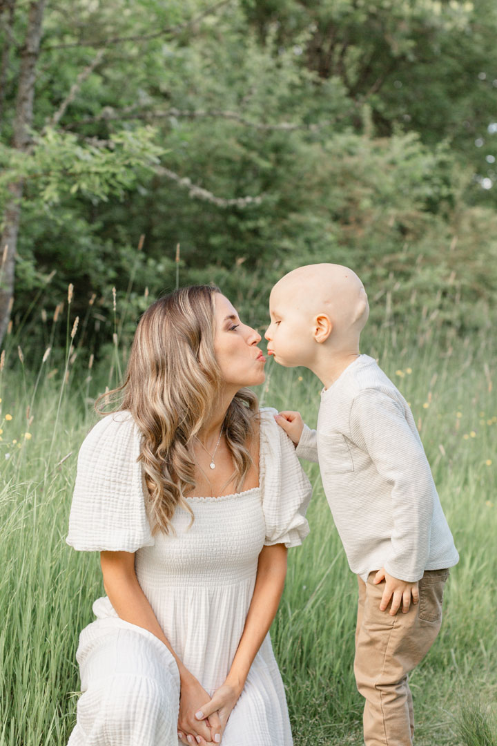 Mom and son kissing during their family photo session in Portland, Oregon