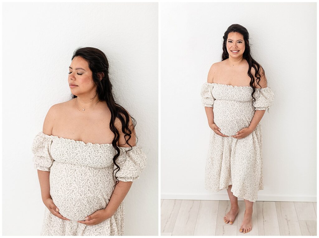 Pregnant woman in off-the-shoulder dress from Nothing Fits But. Holding pregnant belly at Portland Studio Maternity Photo Session. 