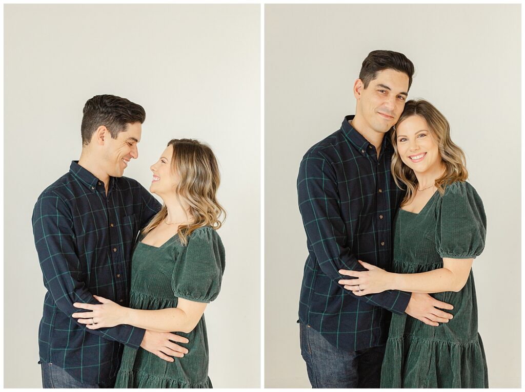 Mom and Dad in blues and greens hugging each other closely during their Portland Studio mini session with Ashlie Behm Photography