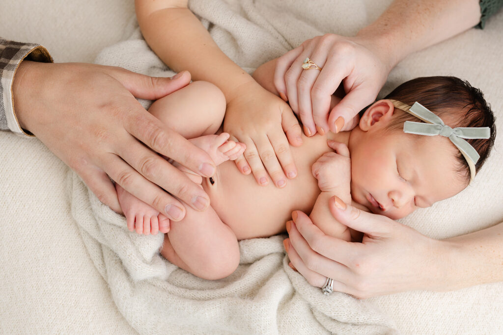 Hands on Newborn baby