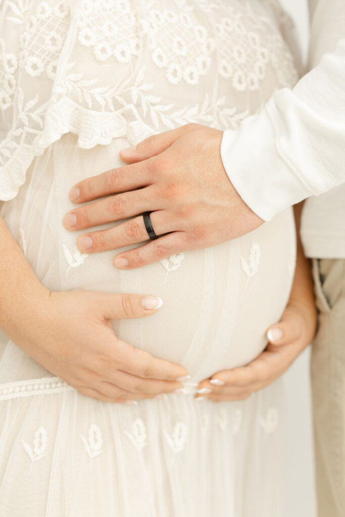 Expecting couple photographed outdoors during a romantic Portland maternity session