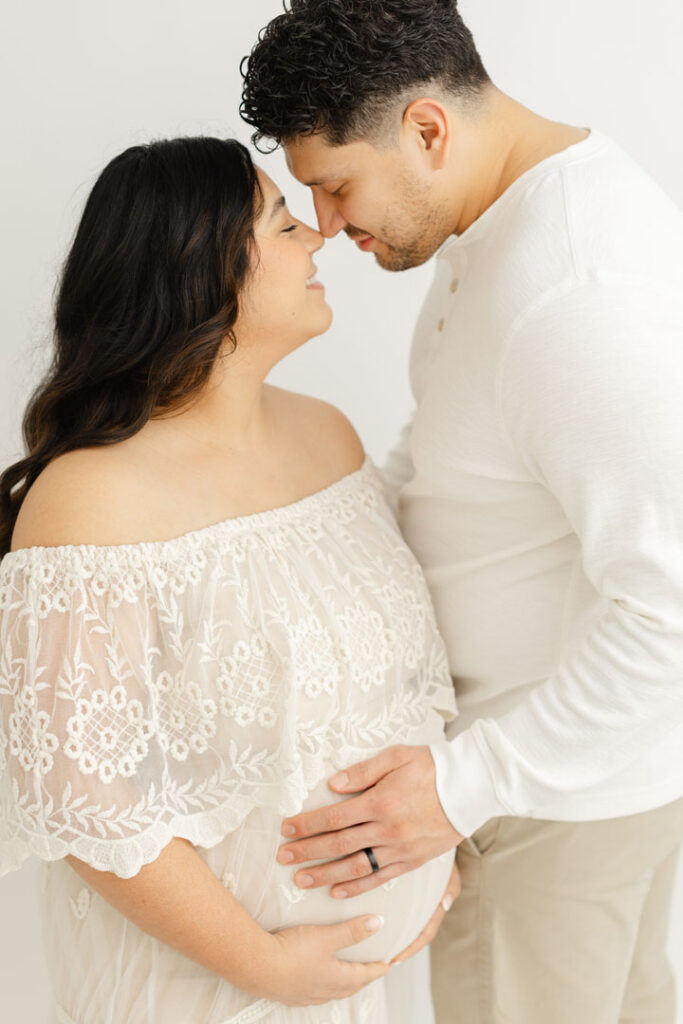 Family enjoying a relaxed outdoor maternity photography session in Portland