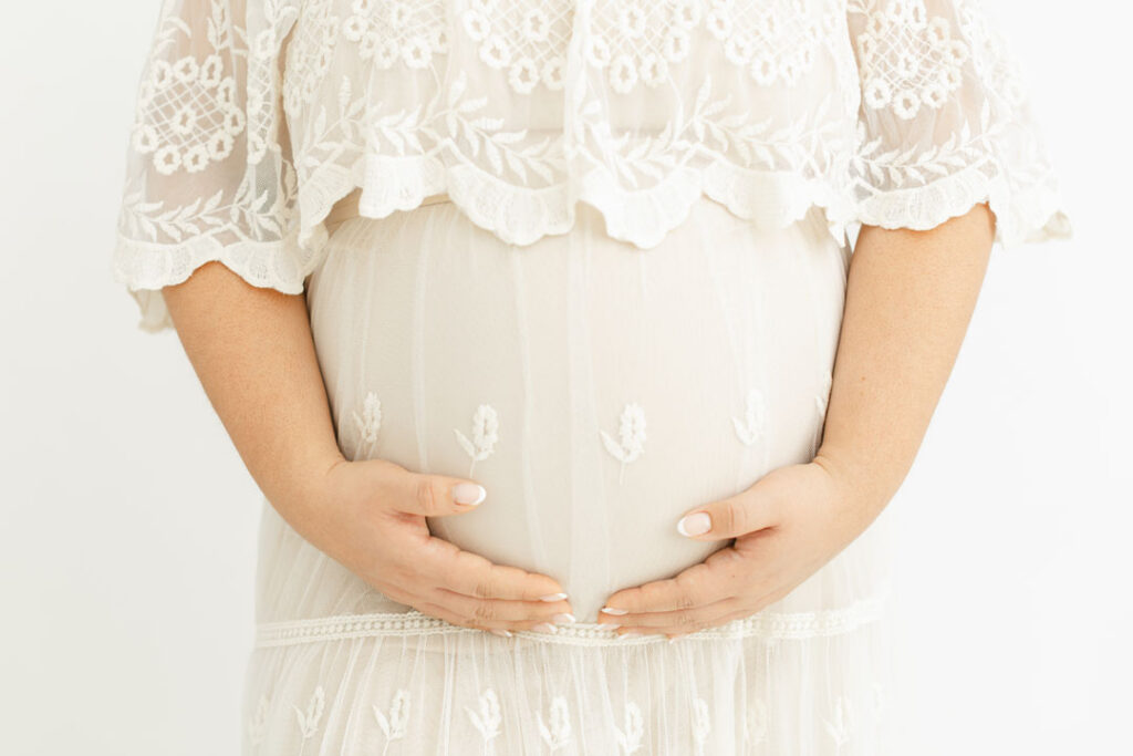 Family maternity portrait with parents and child before welcoming a new baby