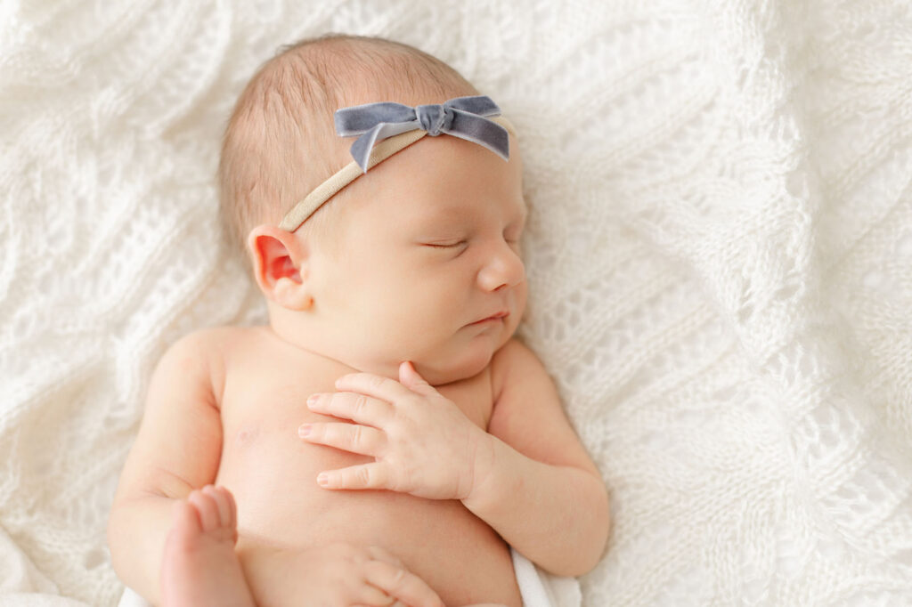 Portland newborn photographer capturing a baby portrait in a studio